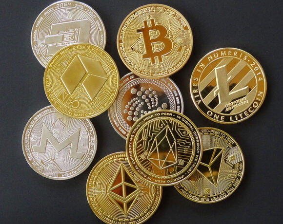 Multiple coins with digital crypto symbols