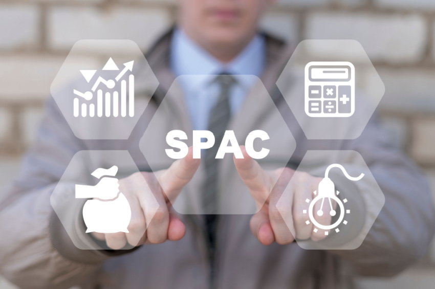 A businessman touching a virtual SPAC button illustrates the concept of SPAC Special Purpose Acquisition Company.