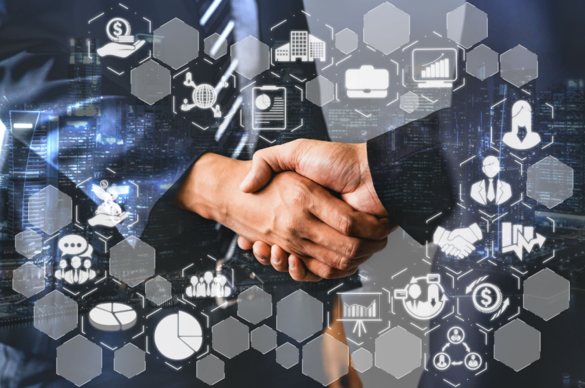 Image of businessmen shaking hands and fintech icons illustrating sucess of a fintech deal.