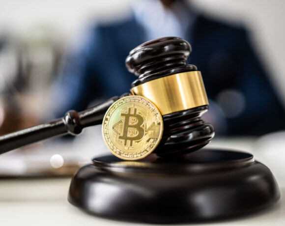 Judge gavel with Bitcoin illustrates the Bitcoin Crypto Regulation And Law.