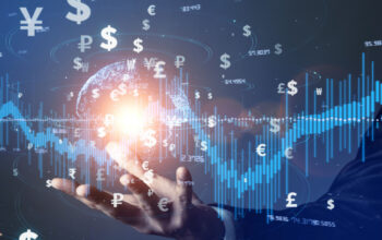 A double exposure image of a businessman holding a digital earth and stock analysis chart with global money symbols illustrates global Fintech investment.