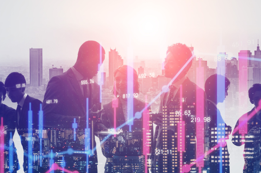 This double-exposure image illustrates the concept of financial technology with a group of businesspeople and a stock growth graph.