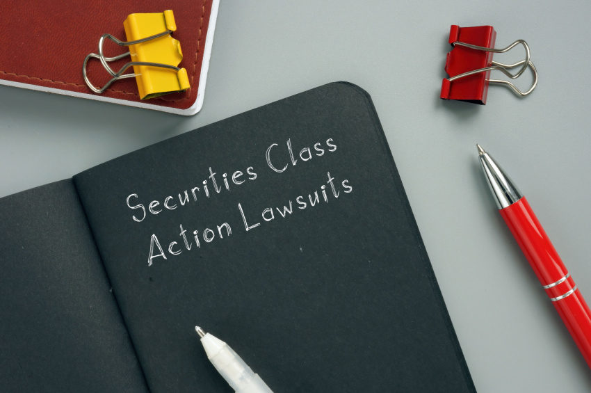 The juridical concept of Securities Class Action Lawsuits with inscription on the sheet illustrates FIS Securities Class Action Lawsuit.