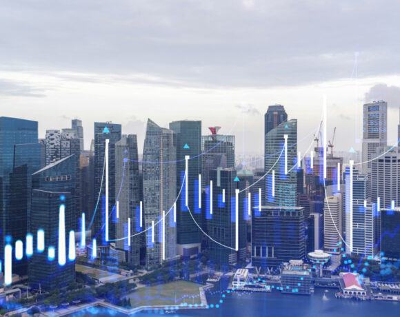 Double exposure image of a Financial stock chart hologram over a panorama city view of Singapore, illustrates the SFA President's Insights on Fintech Ecosystem.